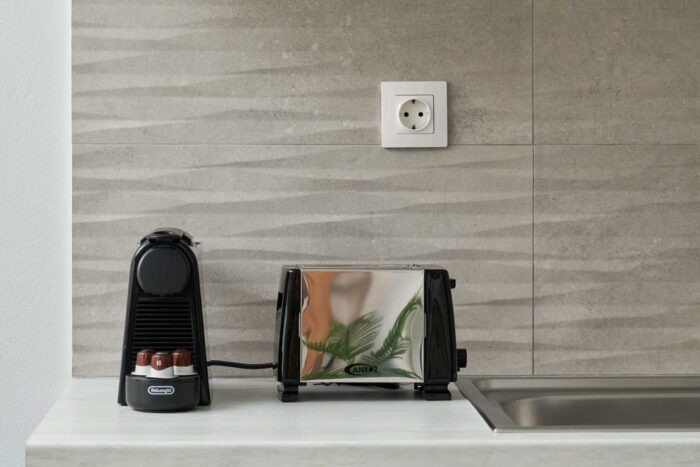 Open-plan living room and kitchen in family apartment in Ierapetra