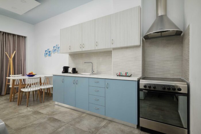 Open-plan living room and kitchen in family apartment in Ierapetra