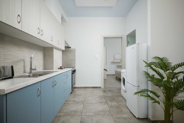 Open-plan living room and kitchen in family apartment in Ierapetra