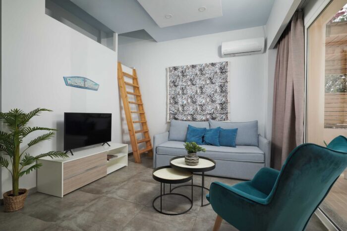 Open-plan living room and kitchen in family apartment in Ierapetra