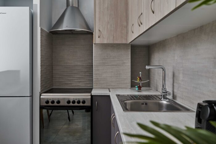 Open-plan living room and kitchen in family apartment in Ierapetra