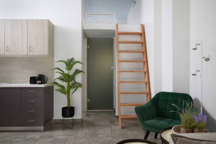 Open-plan living room and kitchen in family apartment in Ierapetra