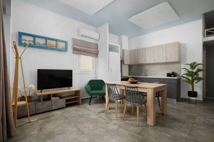 Open-plan living room and kitchen in family apartment in Ierapetra