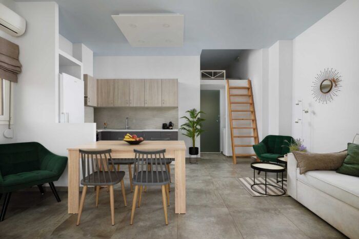 Open-plan living room and kitchen in family apartment in Ierapetra