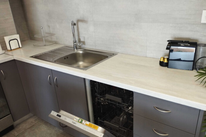 Open-plan living room and kitchen in family apartment in Ierapetra