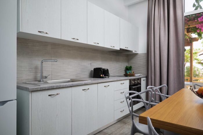 Open-plan living room and kitchen in family apartment in Ierapetra