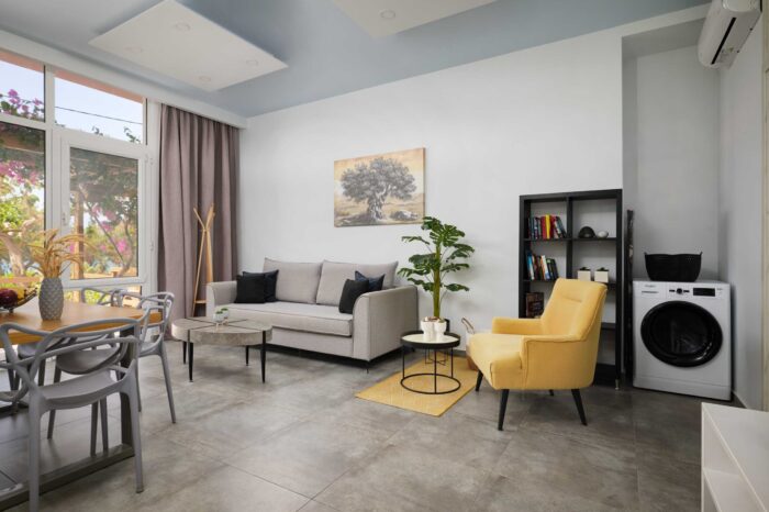 Open-plan living room and kitchen in family apartment in Ierapetra