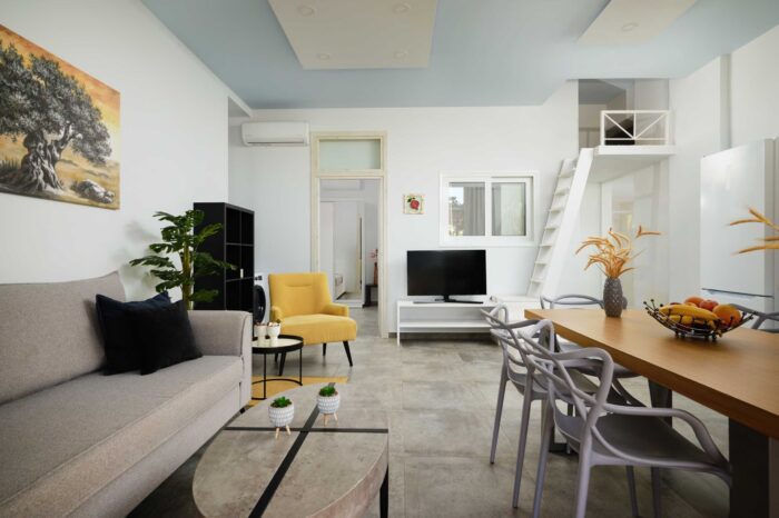 Open-plan living room and kitchen in family apartment in Ierapetra